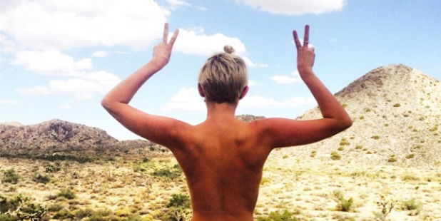 Miley's topless holiday snap has killed off death rumours. Photo/Instagram