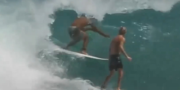 Tim Thompson getting ready to tackle a Brazilian surfer. Photo / YouTube