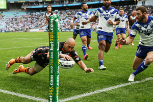 Keith Lulia of the Tigers scores the second of his four tries. Photo / Getty Images