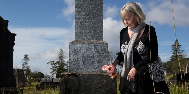 Sue Atkins at the grave of her great-uncle Robert Arthur Hislop (below), the first New Zealand soldier to give his life in the Great War. Photo / Richard Robinson