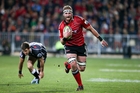 Kieran Read charges in to score for the Crusaders who outplayed the Sharks with their clever running and kicking game in Christchurch. Photo / Getty Images