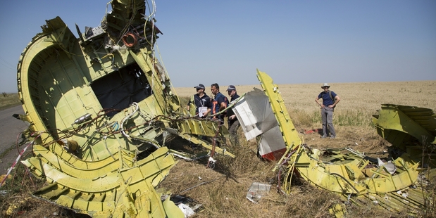 The Australian and Dutch experts are working unarmed as they investigate the atrocity. Photo / AP