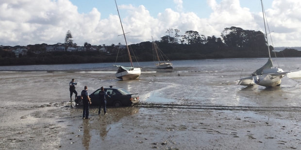 Police said a dry cleaning bill was the only damage done after two men took to the mudflats of the bay near Meola Reef, Westmere, to evade them. Photo / Simon Duffy