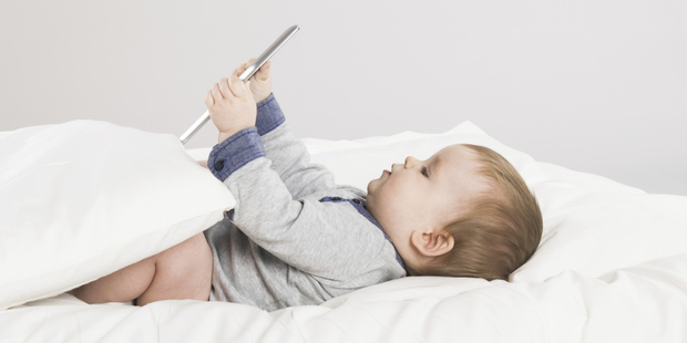 Some babies are saying 'tablet' as their first word. Photo / Thinkstock