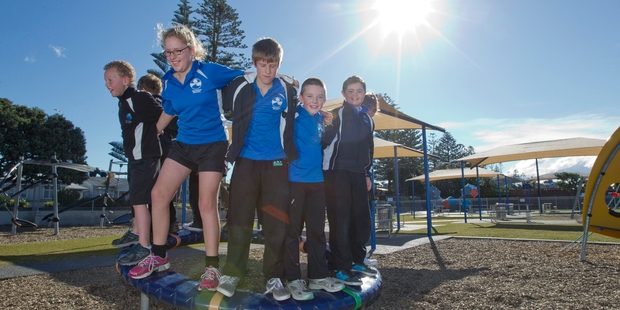SPRING FEEL: It was sunny and warm and perfect for a spot of bouncy fun on Marine Parade in Napier, as these youngsters visiting from Omakere School discovered. PHOTO/GLENN TAYLOR