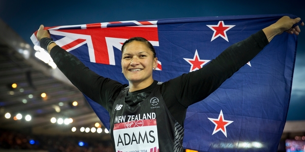 Valerie Adams flies the flag after winning gold in Scotland yesterday to continue her unbeaten run. Photo / Greg Bowker