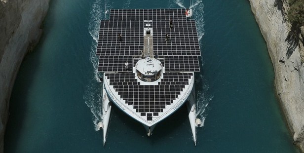 The world's largest solar-powered boat sails through the Corinth Canal near the town of Corinth. Photo / AFP