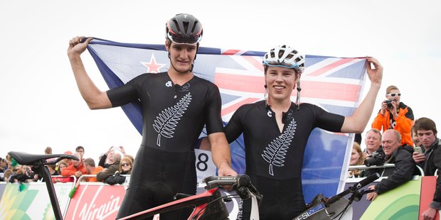 New Zealand Men's Cross Country Mountain Bikers Samuel Gaze, Silver and Anton Cooper, Gold celebrate after racing at Cathlin Braes Mountain Bike Trail at the XX Commonwealth Games. Photo/Greg Bowker.