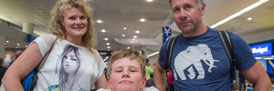 Lianne, Couper (9), and Al Killick from Christchurch, arrive in Auckland after being stuck for four days in Honolulu. Photo / Peter Meecham