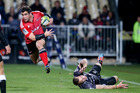 Corey Flynn of the Crusaders jumps out of a tackle during the match against the Sharks. Photo / Getty Images