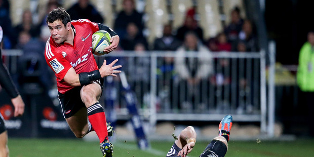 Corey Flynn of the Crusaders jumps out of a tackle during the match against the Sharks. Photo / Getty Images