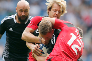 New Zealand's Scott Curry, center, and D J Forbes, left, in action against Canada during the Games. Photo / AP