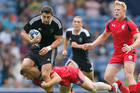 New Zealand's Bryce Heem, left, is stopped by Canada's Harry Jones during the Commonwealth Games. Photo / Getty Images