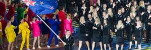 Valerie Adams, the New Zealand Flag bearer leads the New Zealand Commonwealth Games Team. Photo / Greg Bowker