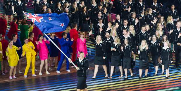 Valerie Adams, the New Zealand Flag bearer leads the New Zealand Commonwealth Games Team. Photo / Greg Bowker