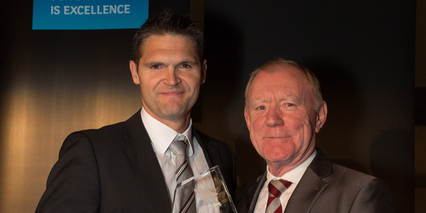 National director of industrial for Colliers International, Greg Goldfinch (left), receives the Commercial and Industrial award from Pat Houlihan of Bauer Media.