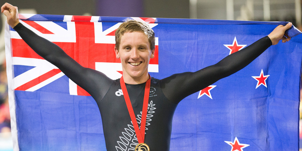 Shane Archbold celebrates after the winning gold in the men's 20km Scratch Race. Photo / Greg Bowker