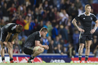 New Zealand Scott Curry, middle, amongst teammates who stand dejected after losing to South Africa. Photo / Greg Bowker