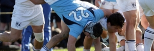 Palmy defenders upend Napier Boys' High School substitute back James Lawson. Photo / Paul Taylor