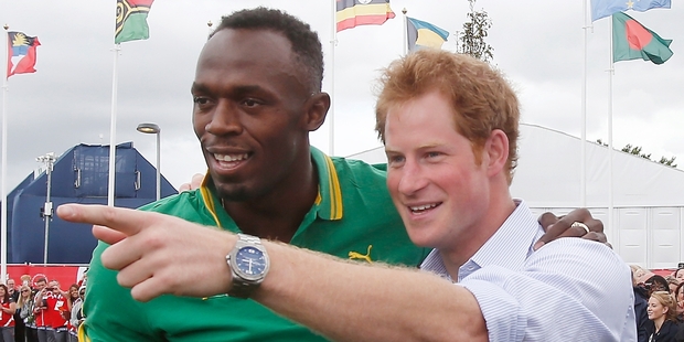 Usain Bolt and Prince Harry get together in the Commonwealth Games village. Picture / AP