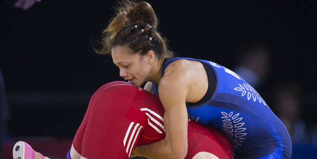 Tayla Ford, in blue, battles against Carissa Holland. Photo / Greg Bowker