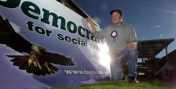 Democrats for Social Credit veteran Barry Pulford checks out the party billboard at his home in Flaxmere. A four-times candidate in Hastings electorates during the past 25 years, he is standing in Napier this year. Photo / Paul Taylor