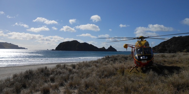 The rescue helicopter at Harataonga Bay today. Photo / Auckland Westpac Rescue Helicopter