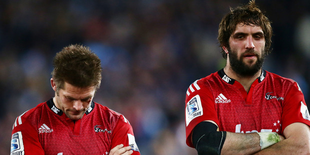 Richie McCaw, left, and Samuel Whitelock, right, of the Crusaders look dejected after the Super Rugby Grand Final match between the Waratahs and the Crusaders. Photo / Getty Images