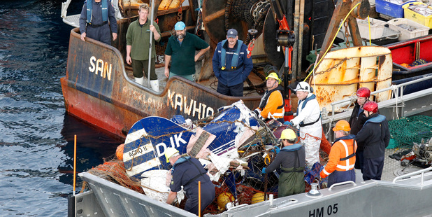 The wreckage is picked up in fishing nets by the the fishing vessel San Kawhia off the southern point of Great Barrier Island. Photo / Chris Gorman
