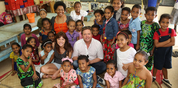 Michael Galvin and Ria Vandervis with a class from Dilkusha Girls School in Fiji. Photo / Jae Frew