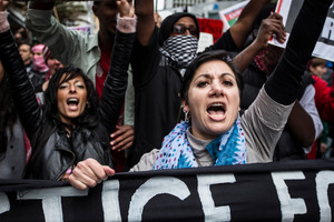 Demonstrators march down Auckland's Queen St to protest Israeli aggression in Gaza and Palestine. Photo / Michael Craig