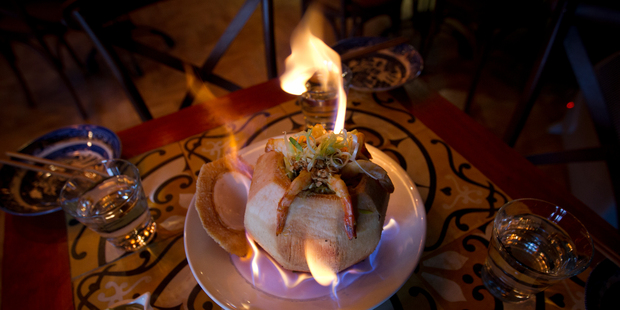 Flaming Prawns in Fresh Coconut. Photo / Sarah Ivey