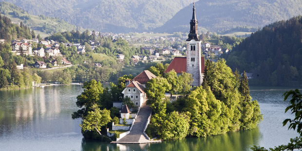 Slovenian grooms are expected to carry their brides up 99 steps to Assumption of Mary Pilgrimage Church. Photo / Getty Images