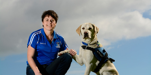 Wendy Isaacs and her puppy Logan - 8 months. Logan will be trained as a dog for the Assistance Dogs Trust. PHOTO/GEORGE NOVAK