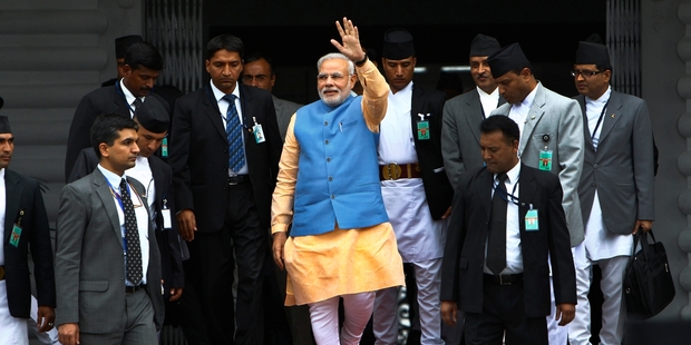 Indian Prime Minister Narendra Modi, centre, this week in Nepal. Once opposed to a goods-and-services tax, Modi is now in favour of the idea. Photo / AP