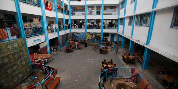 Palestinian families who fled their homes due to fighting between Hamas and Israel take shelter at a U.N.-run school in Gaza City. Photo / AP