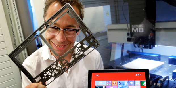 Ralf Groene, chief designer for the Microsoft Surface tablet computer, poses for a photo with a Surface 3 Pro tablet. Photo / AP