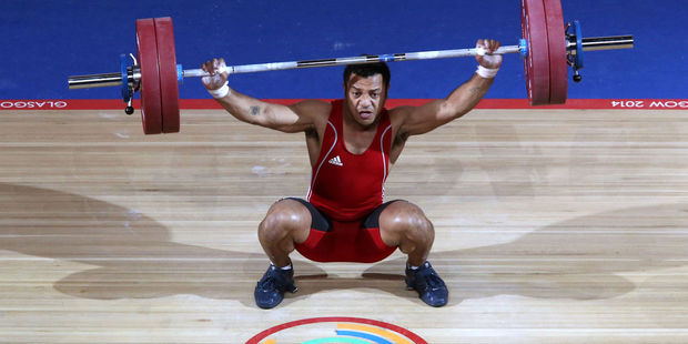 In this image taken Sunday July 27 Papua New Guinea's Toua Udia competes in the Clean and Jerk of the men's 77kg Weightlifting in Glasgow. Photo / AP