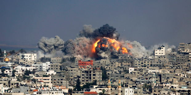 Smoke and fire from the explosion of an Israeli strike rise over Gaza City. Photo / AP