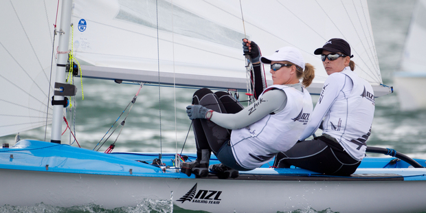 Skipper Jo Aleh and crew Polly Powrie roll tacks on the last day of the Oceanbridge Sail Auckland Regatta in the 470 class. Photo / Richard Robinson.