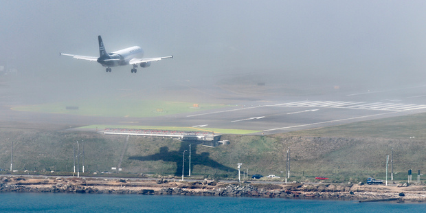An Air NZ jet on final approach moments before aborting an attempted landing on the fog-bound runway. Photo / Mark Mitchell