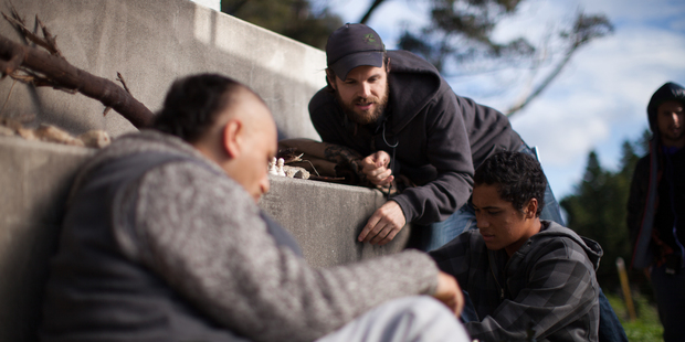 James Napier Robertson (above) with Cliff Curtis and James Rolleston on the set of The Dark Horse. Photo / Supplied