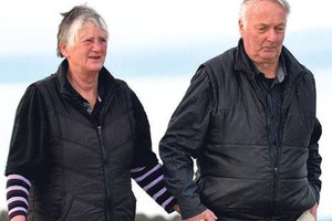 Pam and Paddy Paterson enjoy a walk on the beach at Kaka Point yesterday. Photo / Peter McIntosh