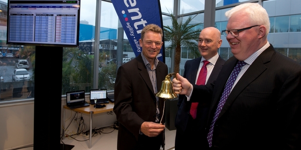 bewly listed Gentrack chief executive James Docking (left) and chairman John Clifford ring in the new era with NZX chief executive Tim Bennett (right). Photo / Brett Phibbs