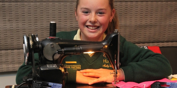 Molly Lee, 13, is aiding child cancer sufferers by sewing goody bags, to be filled with donated goods. Photo / Duncan Brown