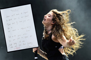 Lyrics to the chorus of Royals were written out by Lorde and signed by her and the song’s producer, Joel Little. Photo/Getty