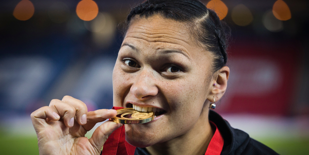 Valerie Adams celebrates after winning gold in the women's shot put. Photo / Greg Bowker