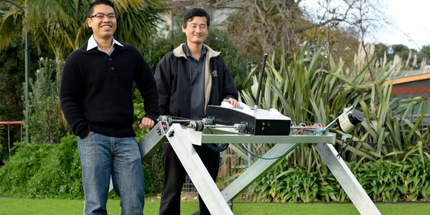 Chee Kit Wong (left) and Patrick Lim demonstrate an experimental robot platform for agriculture.