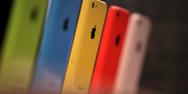 The iPhone 5C is displayed during an product announcement. Apple is rumoured to be unveiling a new bigger iPhone 6 next month. Photo / Getty