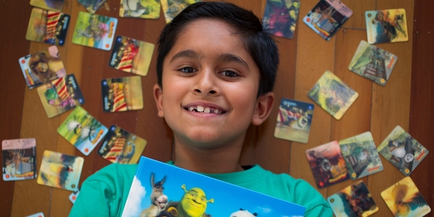 Ethan Dharmai, 9, collected the 42-card set of Countdown's Dreamworks Heroes this year. Photo / Sarah Ivey